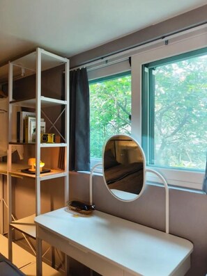A room with a white desk, a mirror, and a window with a view of trees. - NONHYEON Station GANGNAM - Double Bed Studio - Private Apartment #Clinic #Travel (Seoul)
