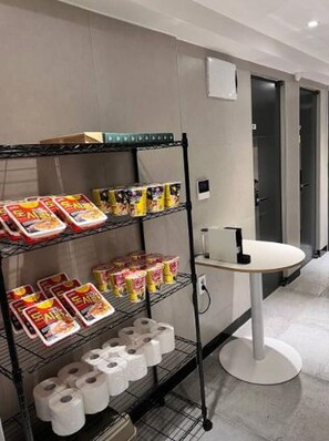 A hotel bathroom with a shelf stocked with toilet paper and other toiletries. - NONHYEON Station GANGNAM - Double Bed Studio - Private Apartment #Clinic #Travel (Seoul)