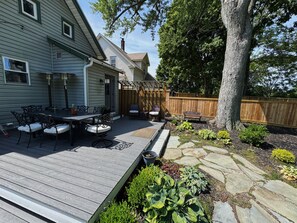 A wooden deck with outdoor furniture, a pergola, and a stone pathway. - Celtic harbor house three minute walk from harbor (Ashtabula)