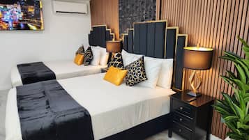 1 quarto, ferros/tábuas de passar roupa, berço de viagem