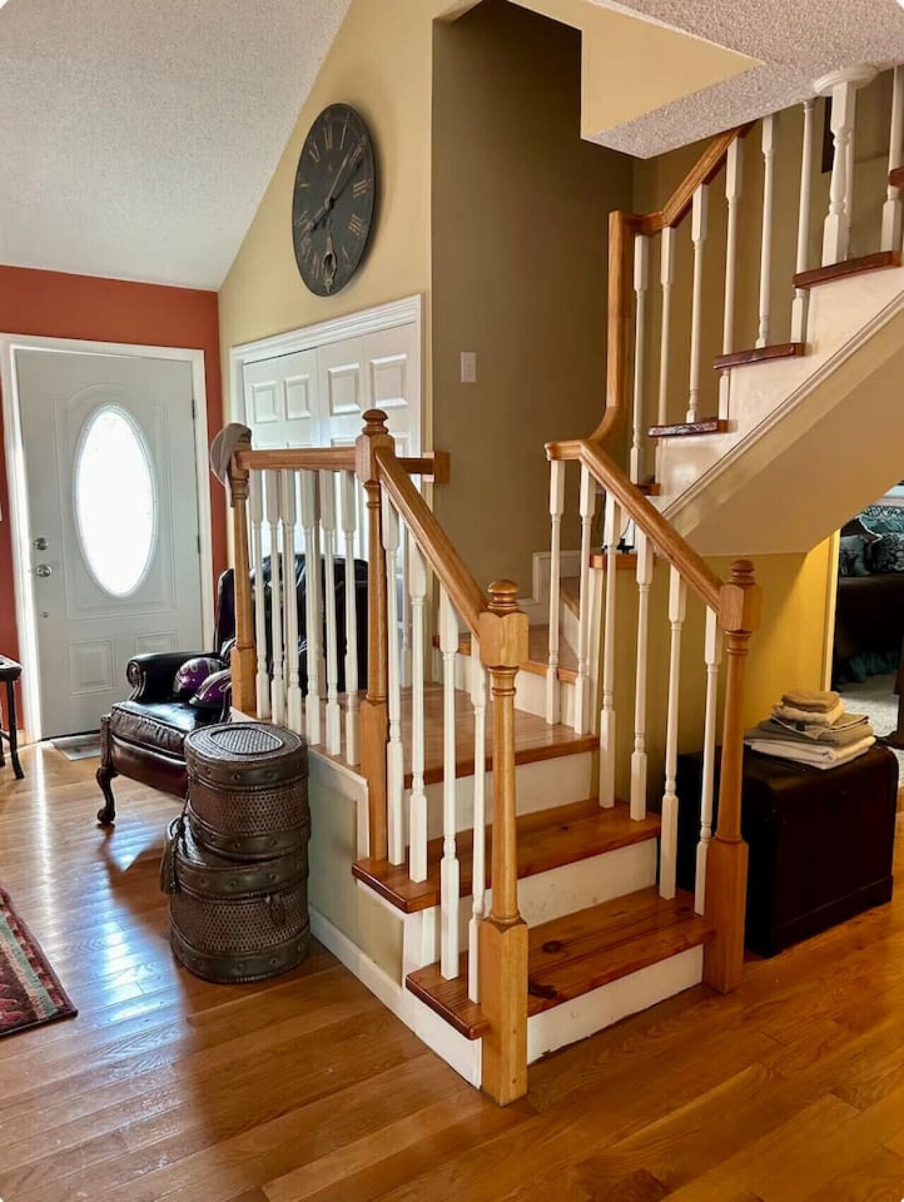 A staircase with wooden railings and a carpeted floor.
