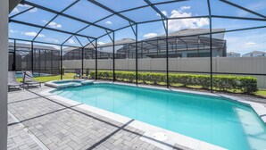 A swimming pool with a clear view of the sky through a metal roof structure. - Stunning Windsor Island 10BR (Davenport)