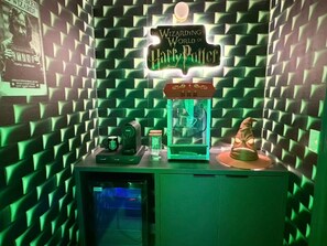 A room with a green, textured wall, a sign reading 'The Wizarding World of Harry Potter,' and a 3D printer on a table. - Custom Bedrooms 10 BD/8 BA/ Windsor Cay - 15906 CK (Clermont)