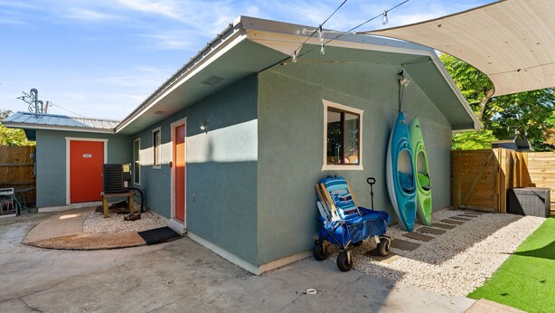 A single-story house with a garage, a covered patio, and a small front yard with a gravel path. - POOL/Golf Cart/Hot Tub/Playground/Grill/Arcades (Panama City)