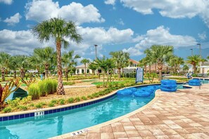 A swimming pool with a 3 ft depth marker, surrounded by palm trees and a tiled deck. - Mickey & Mario Luxury Retreat, private pool (Kissimmee)