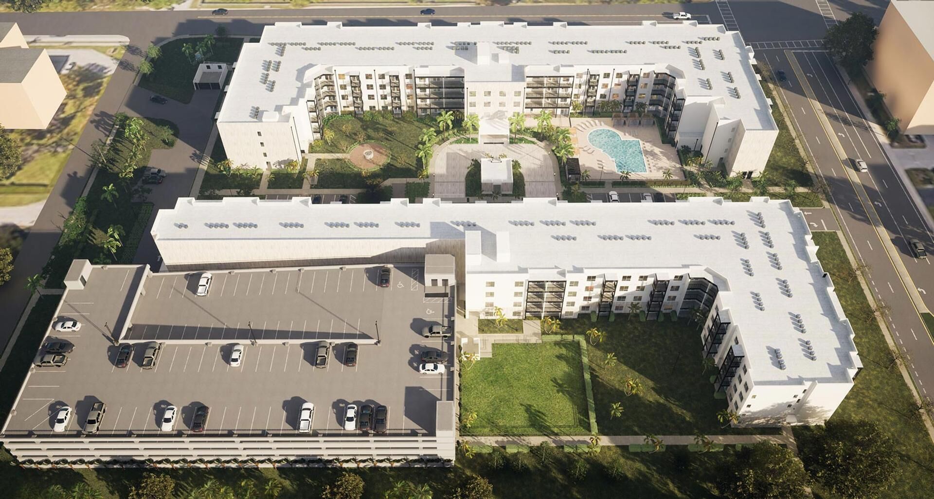 Un hotel de varios pisos con piscina en la azotea, estacionamiento y zonas ajardinadas.