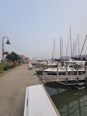 A marina with boats docked, a walkway, and a lamp post. - Charming 3-bedroom house in marvelous Township of Burtchville with AC (Township of Burtchville)