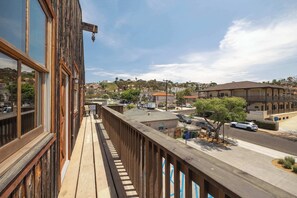 A balcony with a view of a street and buildings, including a Miller Business & Legal Center. - OldTown Barnhouse 2Units Historic OldTown & Dining (San Diego)