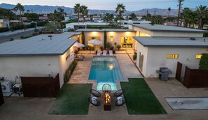 A modern residential property with a swimming pool, outdoor seating, and a view of mountains. - Play and Stay Sanctuary - Detached Casita + Pickleball + Putting Green • Casita + 4 Kings (Palm Springs)
