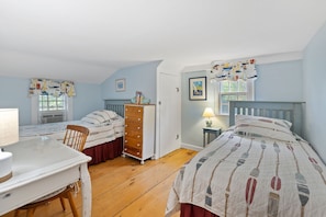 A bedroom with two single beds, a dresser, a desk, and a chair. - Spacious pet-friendly home, close to Nauset & Skaket beaches and Orleans village (Orleans)