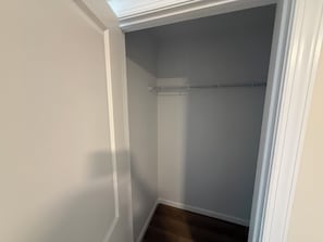 A narrow hallway with a closet and a wooden floor. - Excellent 3-bedroom house with AC in cool Louisville neighborhood (Louisville)
