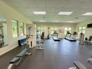 A gym with treadmills, exercise bikes, and a bench. - Del Mar Golf View Retreat at Los Buenos Resort (Herradura)