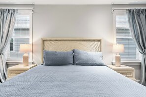 A bed with a headboard, two pillows, and two bedside lamps. - The Emerald at 30A: Heated Pool, Golf Cart, Bikes (Santa Rosa Beach)