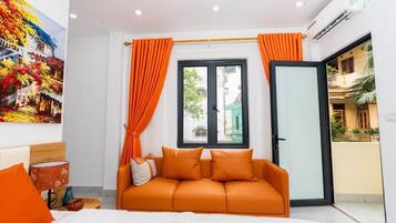 Deluxe Suite, City View | Pillowtop beds, desk, laptop workspace, blackout drapes