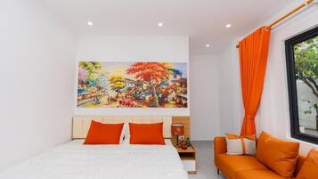 Suite Deluxe, vistas a la ciudad | Colchones con acolchado adicional y escritorio