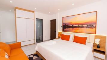 Deluxe Suite, City View | Pillowtop beds, desk, laptop workspace, blackout drapes