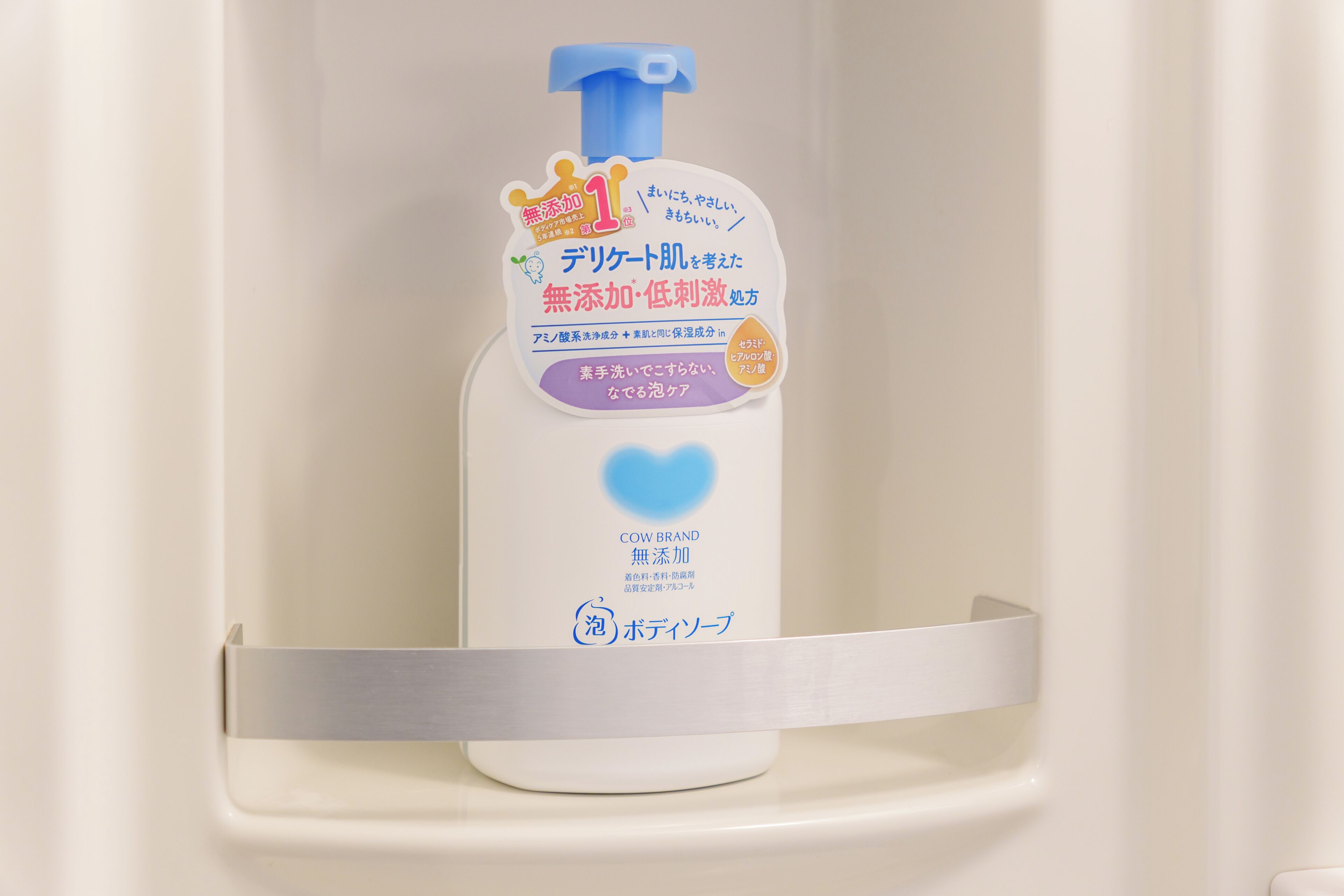 A bottle of Cow Brand soap in a bathroom shelf.