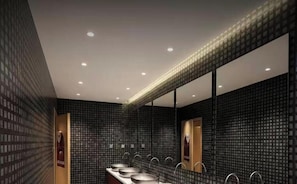 A modern bathroom with a large mirror, multiple sinks, and a patterned wall design. - Mars respawn hotel (Ulaanbaatar)