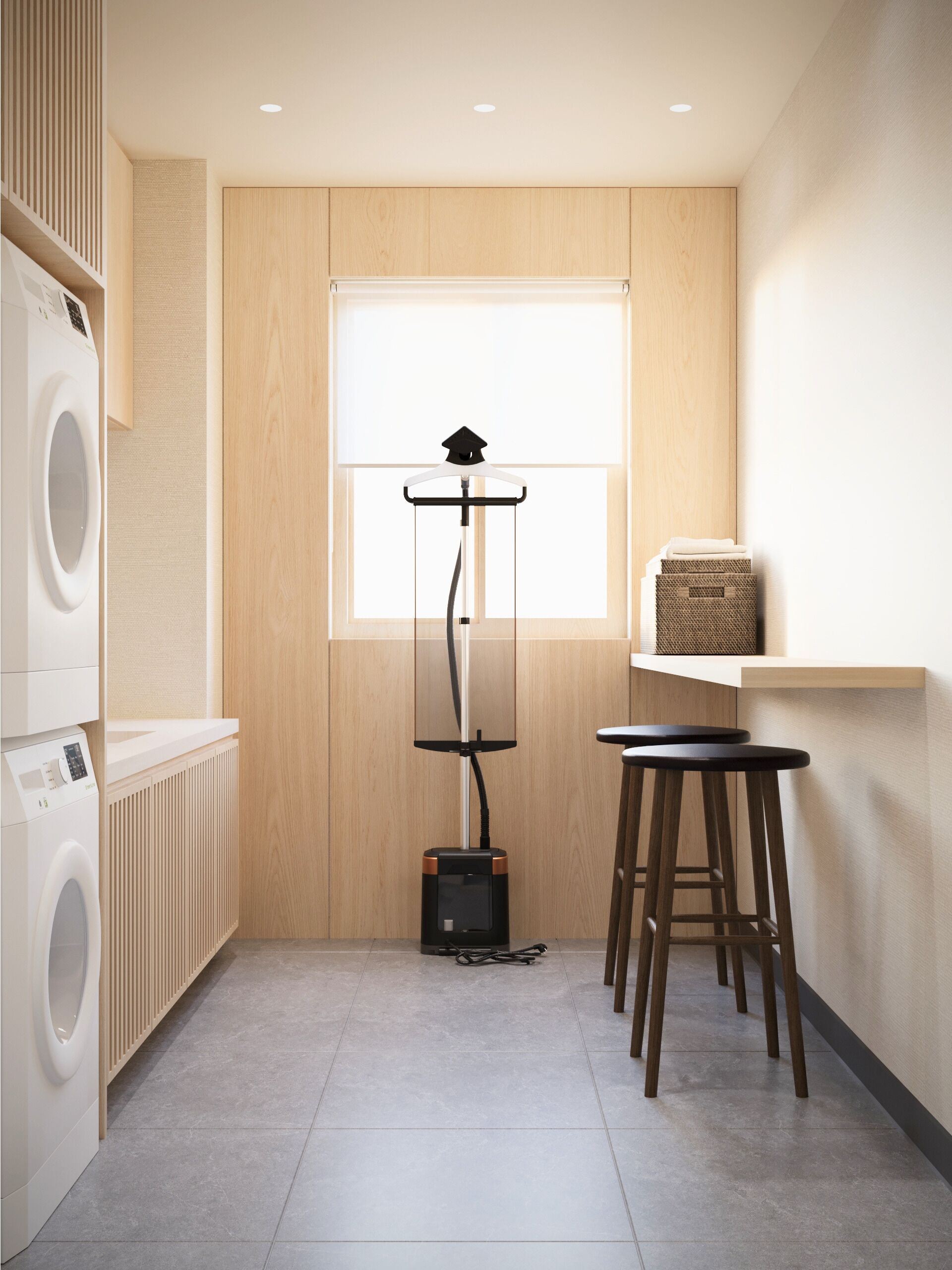 A laundry room with a washing machine, a drying rack, and a vacuum cleaner.