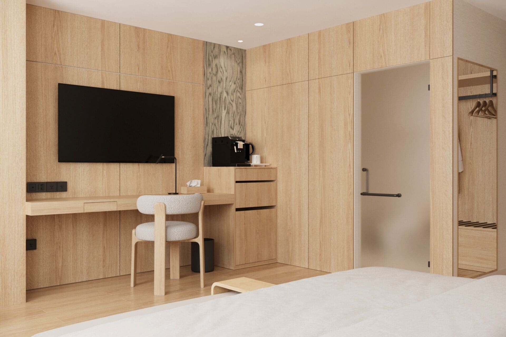 A modern bedroom with a wooden desk, a chair, a bed, and a wardrobe.