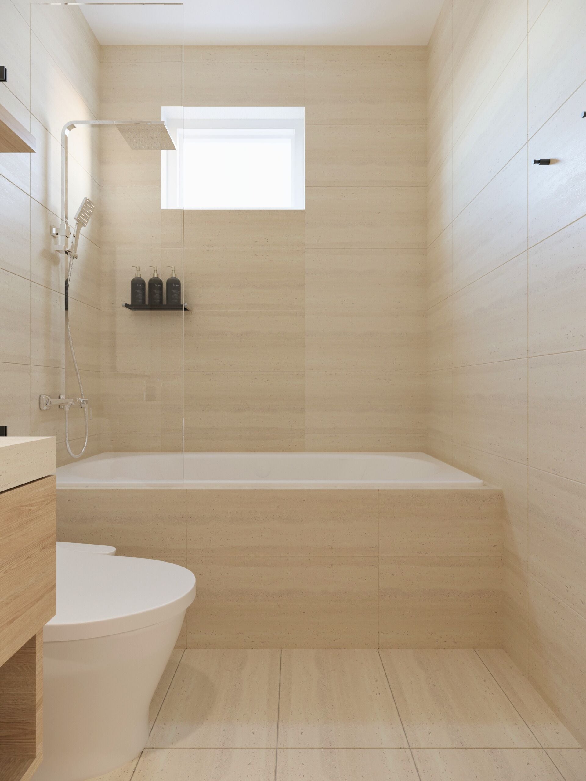 Un baño moderno con bañera, inodoro y zona de ducha.