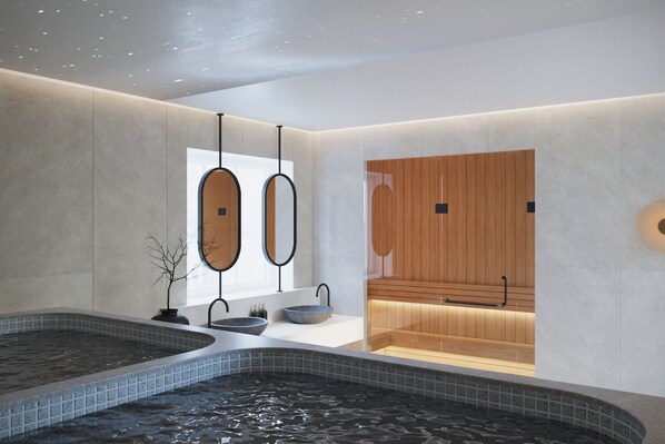 A modern spa with two large tubs, a wooden sauna, and a minimalist design. - AMAROU Saigon (Ho Chi Minh City)