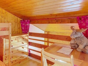 A wooden cabin interior with bunk beds, a table, and a stuffed animal. - Les Grandes Aiguilles by Interhome (Saint Gervais)