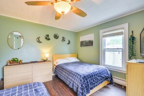 A bedroom with a bed, a dresser, a mirror, a ceiling fan, and a window with blinds. - Walk to Dtwn Clayton & River! 2-Unit Getaway (Clayton)