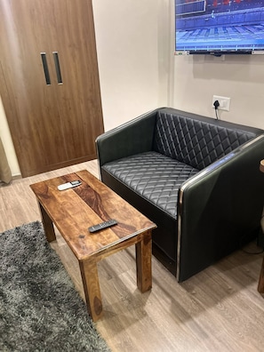 Apartment, 1 Bedroom, Smoking, Balcony | Living area | Books - Luxury Stay for Solo Couple Triple Near Pari Chowk Expo Mart for up 4 Guests (Greater Noida)