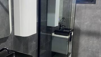 Shower, free toiletries, hair dryer, slippers