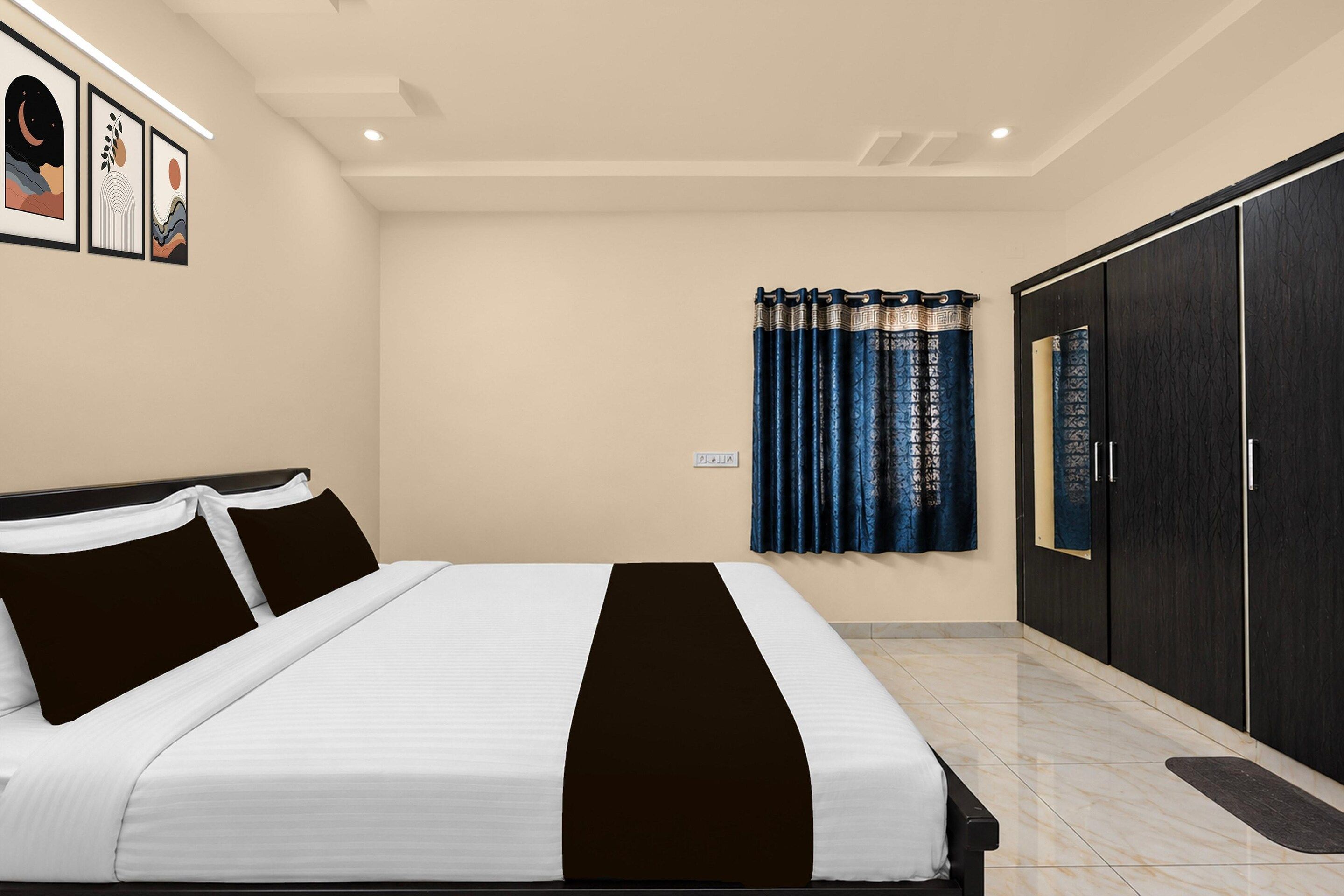 Un dormitorio con cama, armario y ventana con cortinas.