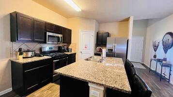 Coffee/tea maker, fridge, microwave, oven