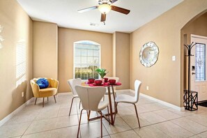 A dining area with a table, chairs, and a ceiling fan. - Crowley | Insurance & Crew Ready · Office · Yard (Crowley)