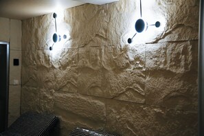 A textured wall with recessed lighting fixtures. - Nature Heals by Todoroff (Devin)