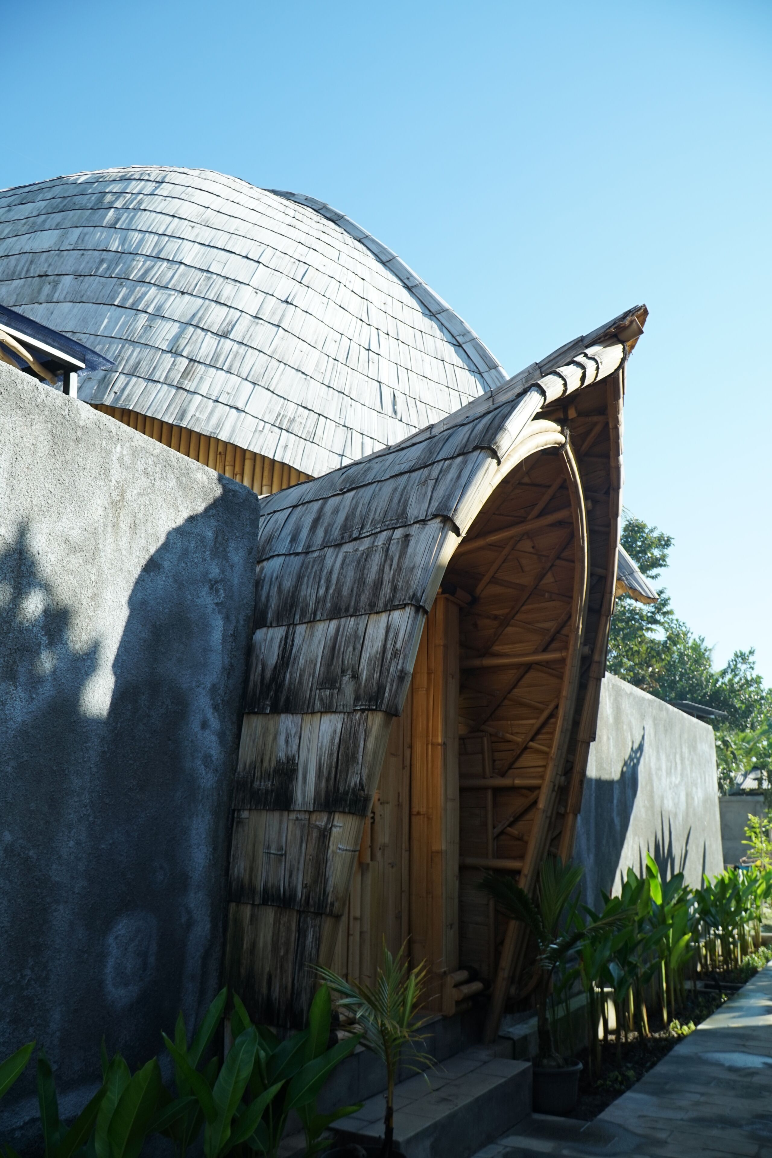 A building with a large dome and a wooden structure.