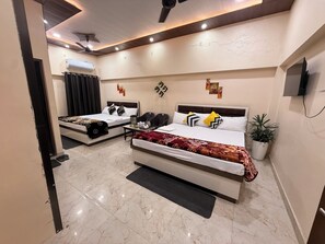 Deluxe Quadruple Room, Multiple Beds, Balcony, City View | Iron/ironing board (on request), WiFi (free) - Thakur Homestay (Varanasi)
