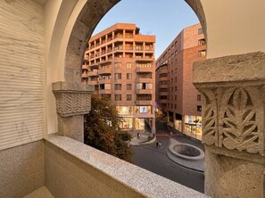 A view through an archway of a multi-story building with a central courtyard. - Stylish stay in a heart of Yerevan between Republic Square and Opera (Yerevan)