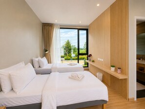 A modern hotel room with two beds, a large window, a wooden accent wall, and a small balcony.