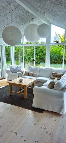 A bright vacation home on private property. Located close to nature and the beach.