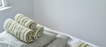 A bright vacation home on private property. Located close to nature and beach.