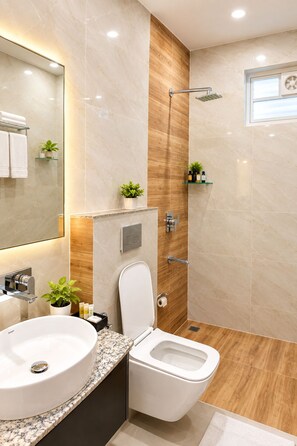 A modern bathroom with a sink, toilet, and shower. - Hotel Grey Stone B & B (Amritsar)
