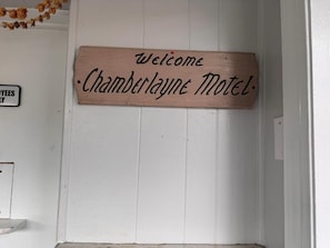 A wooden welcome sign for the Chamberlayne Motel. - Chamberlayne Motel (Richmond)