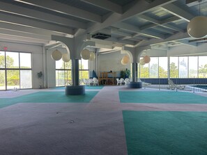 An indoor space with a high ceiling, large windows, and a central column with spherical decorations. - Your Relaxing Silver Beach Escape in Saint Joseph - Benton Harbor (Benton Harbor)