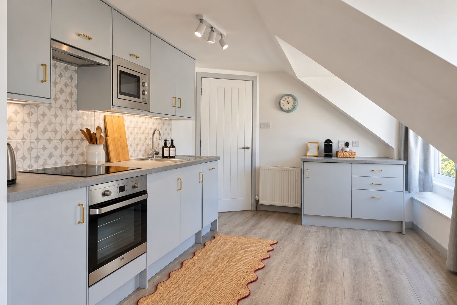 Bright modern kitchen with stylish finishes and a cozy coffee station
