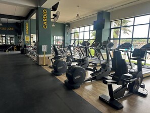 A gym with cardio equipment, a sign for 'Cardio Zone', and a 'Cardio Boy' sign. - Luxurious 2-bedroom Apartment in Pretoria With Pool Access (Pretoria)