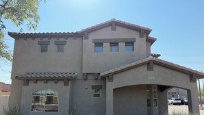 A two-story building with a garage, numbered 1120, and a covered driveway. - ASU Parent, Alumni, Sports Fan, Traveler - this is your place. (Tempe)