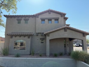 A two-story building with a garage, numbered 1120, and a covered driveway. - ASU Parent, Alumni, Sports Fan, Traveler - this is your place. (Tempe)