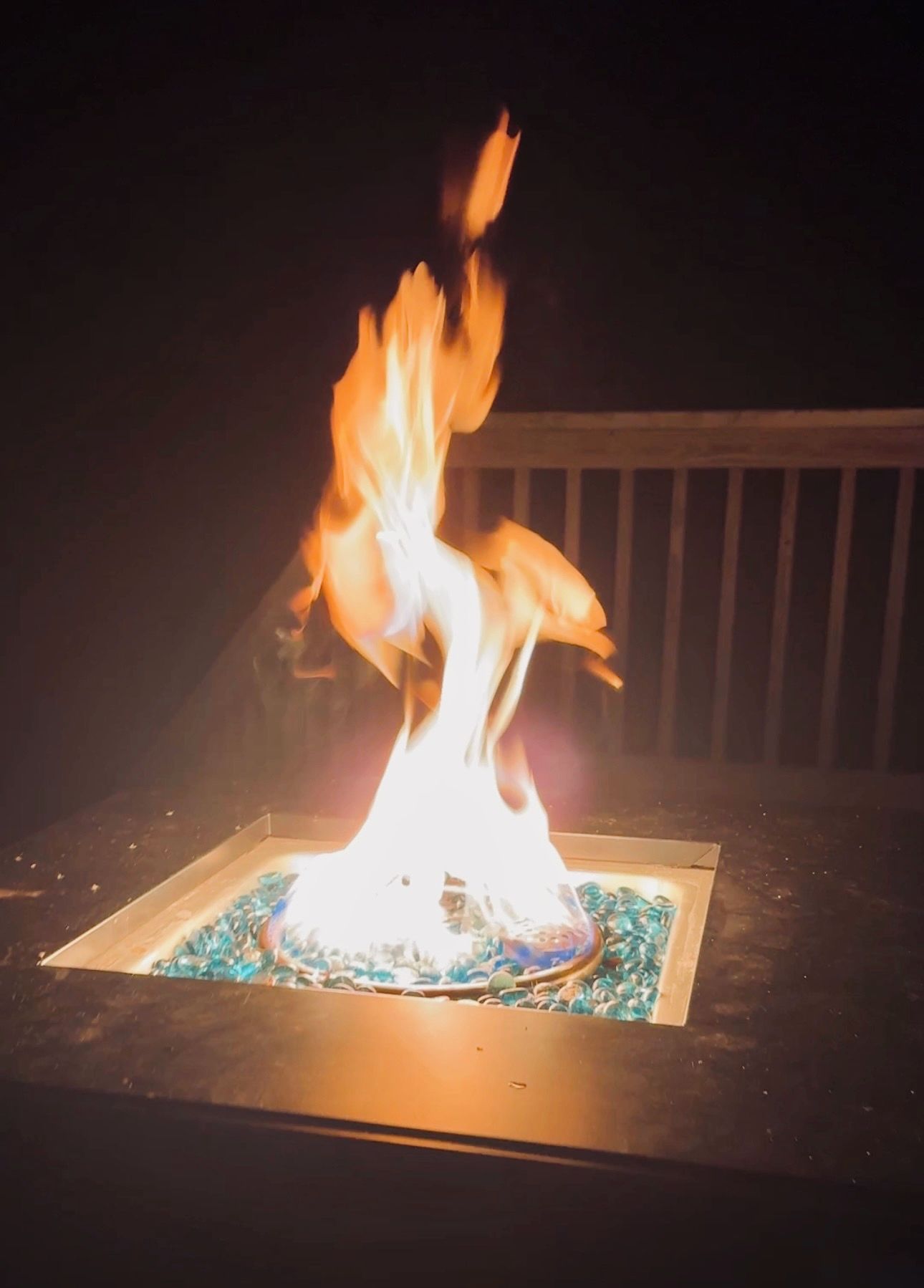 A fire feature with flames rising from a square base.