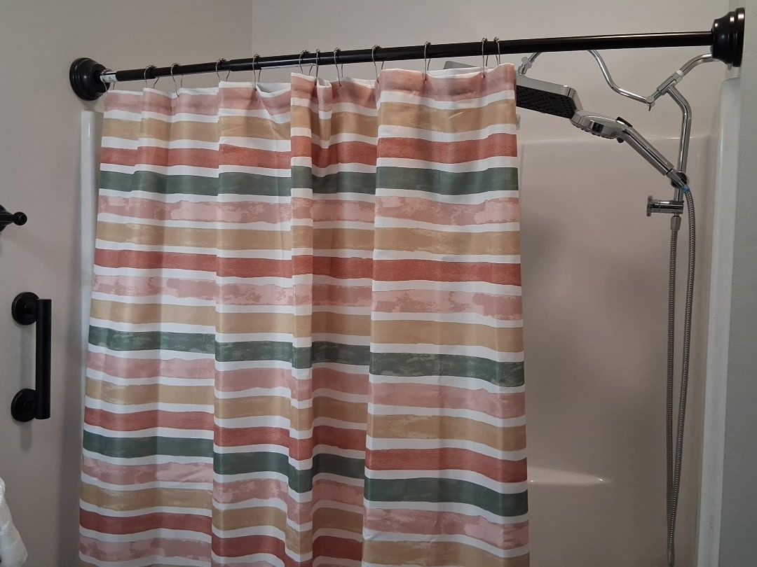 A shower curtain with horizontal stripes in various colors.