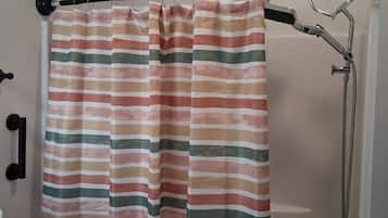 A shower curtain with horizontal stripes in various colors.
